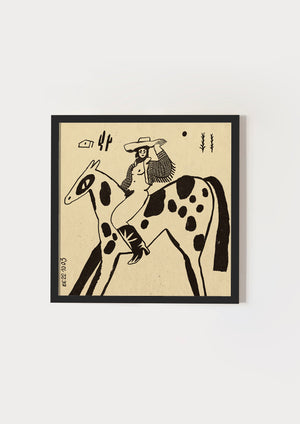 Cowgirl on spotted horse